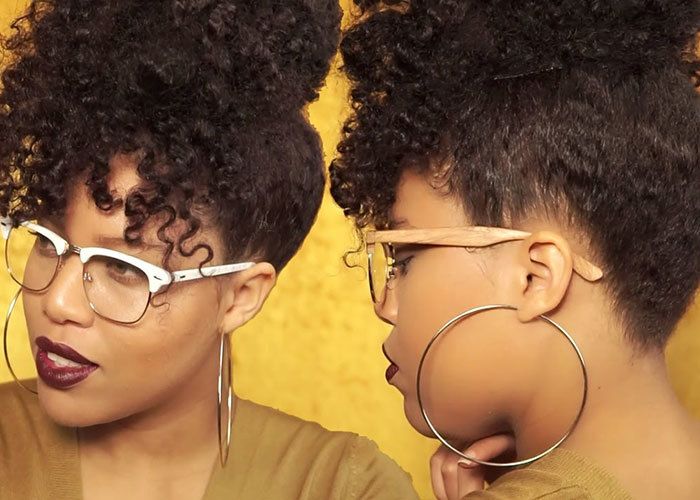 woman with natural hairstyle wearing glasses