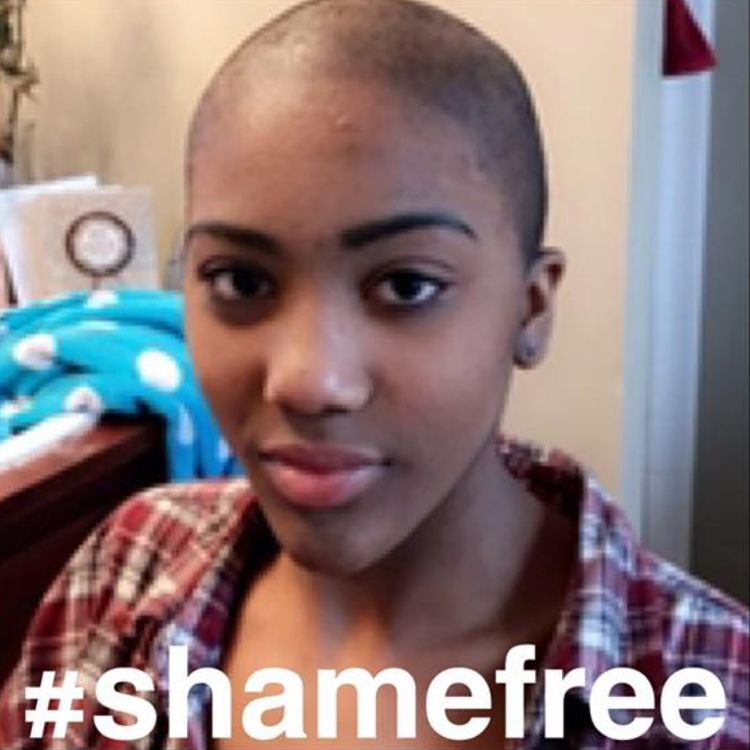 Lulu, a black teenager, shows off her newly buzzed hair cut