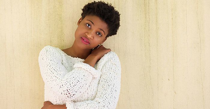 Young african american woman standing with arms crossed by m-imagephotography