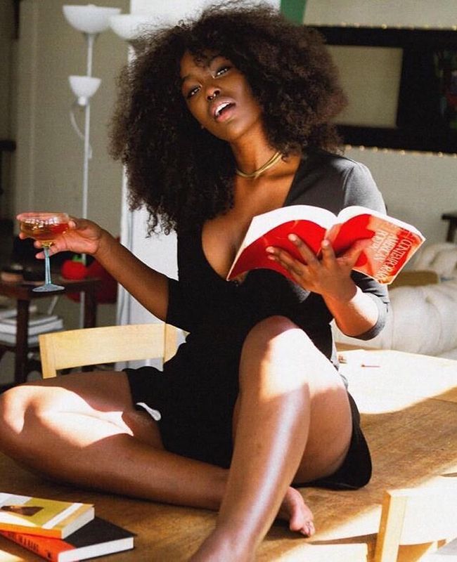 woman reading African-American woman sitting down reading