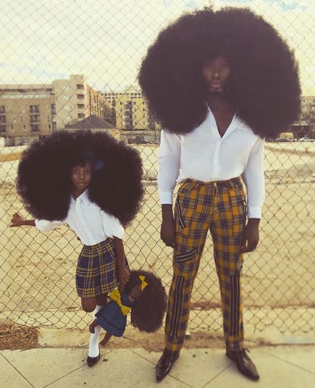 father and daughter with afros Father and daughter dressed alike with afros