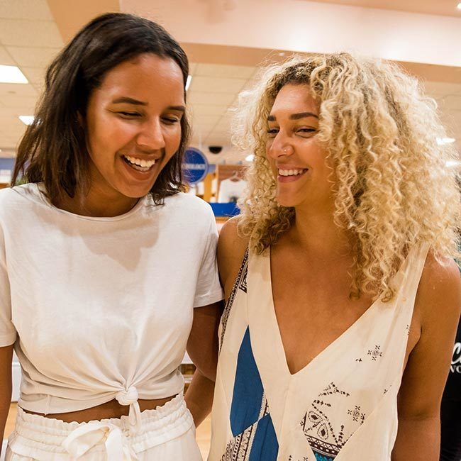 NaturallyCurly intern Kiana Tipton and friend attend The Curl Revolution book tour in Austin, TX