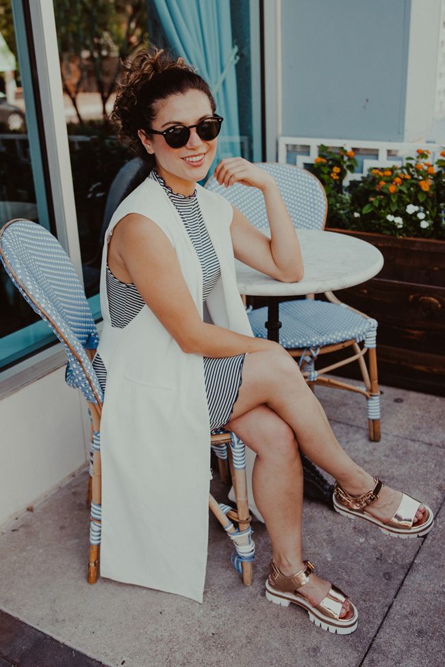 ootd cristina girl sitting at cafe table