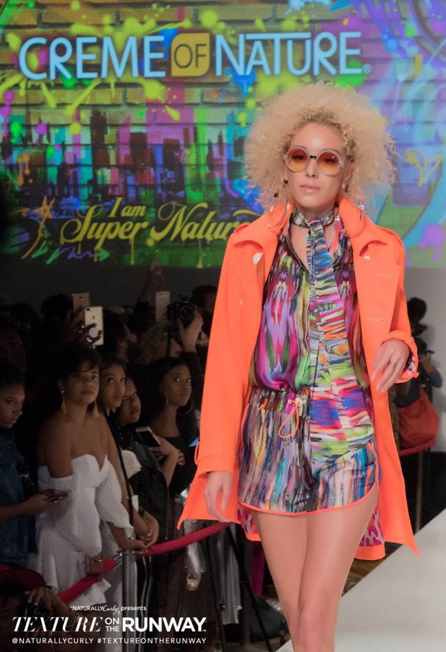 a model with a blonde twistout walks the runway NaturallyCurly