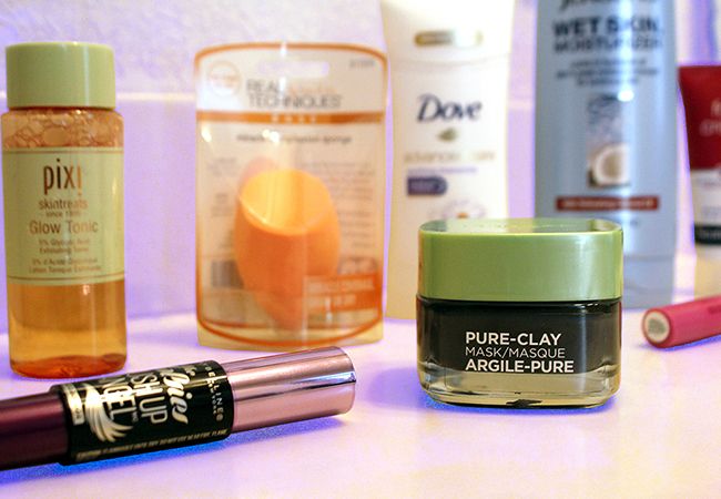 Beauty products laying on bathroom counter