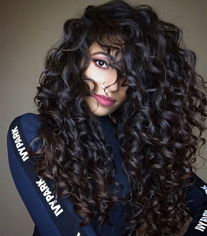 this is how ayesha styles her long wavy hair