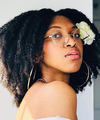 6 Stunning Ways to Add Flowers to Your Curly Hair